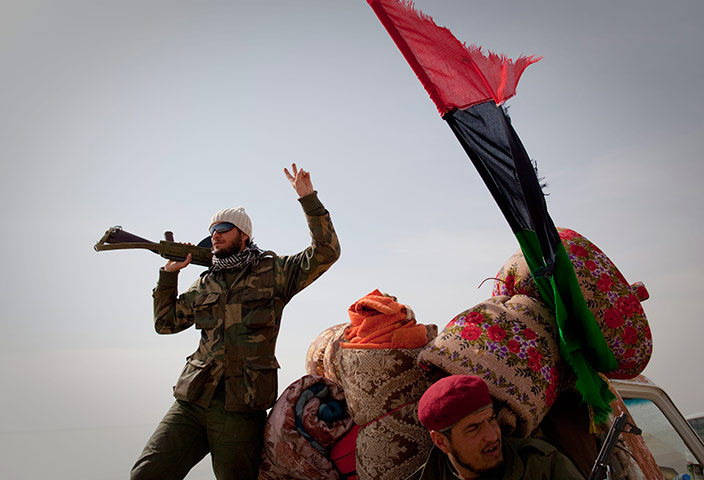 Eastern Libya: Libyan rebels gesture on a checkpoint in Al-Egila, east of Ras Lanuf