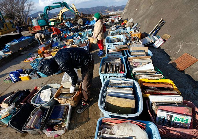 Japan: Crates of possessions found near Okawa Elementary School in Ishinomaki are laid out for people to search