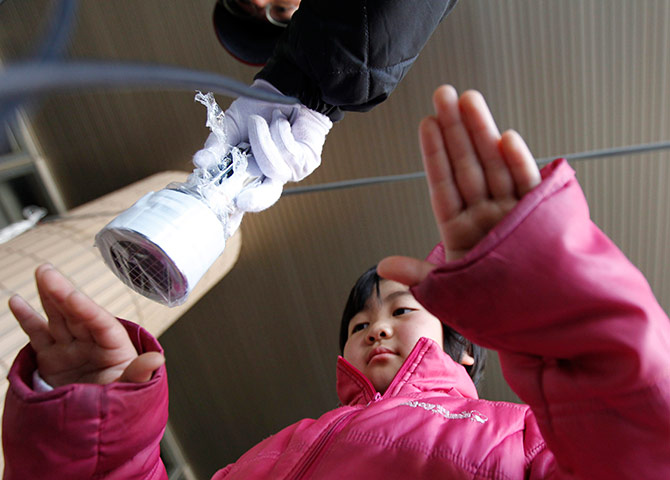Japan: Child is tested for possible nuclear radiation in Fukushima