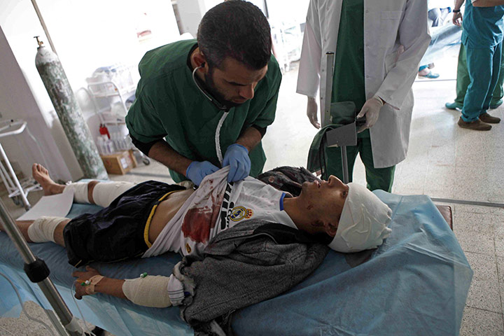 Conflict in Libya: An injured rebel is treated in a hopital in Ras Lanouf 