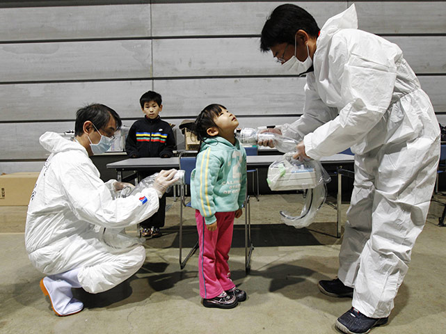 Japan nuclear crisis: tested for possible radiation exposure at an evacuation center in Koriayama