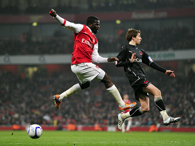 Wednesday FA Cup: Arsenal's Emmanuel Eboue vies with Leyton Orient's midfielder Tom Carroll 