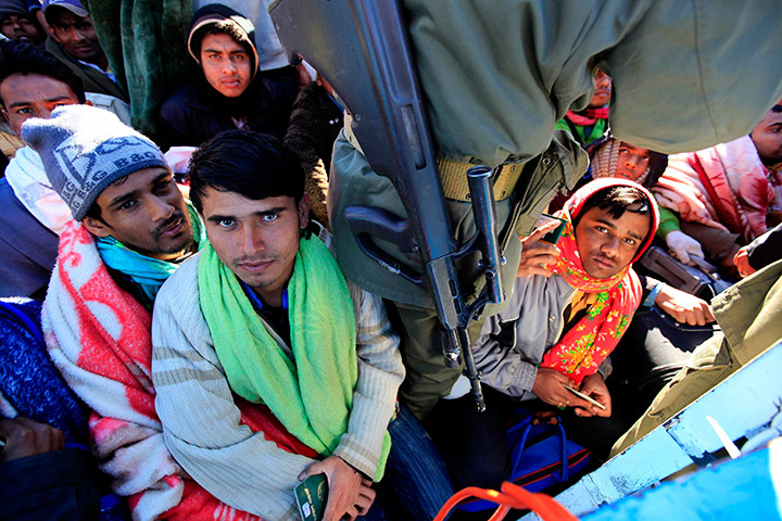 Refugees Flee Libya: Bangladeshi migrant workers fleeing the unrest in Libya 