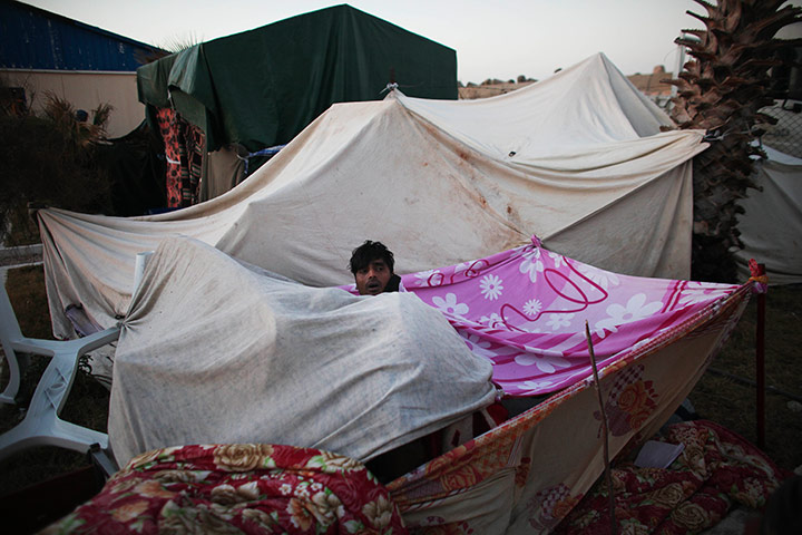 Refugees Flee Libya: Bangladeshi workers wait to be evacuated from Libya in Benghazi