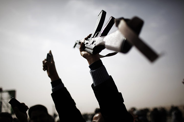 24 hours in pictures: Libyan rebels raise their arms in Ajdabiya