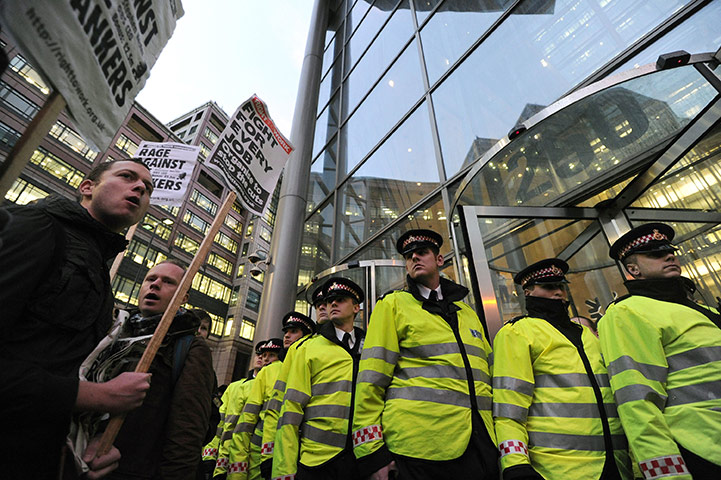 Business Week: Police officers guard the entrance of RBS