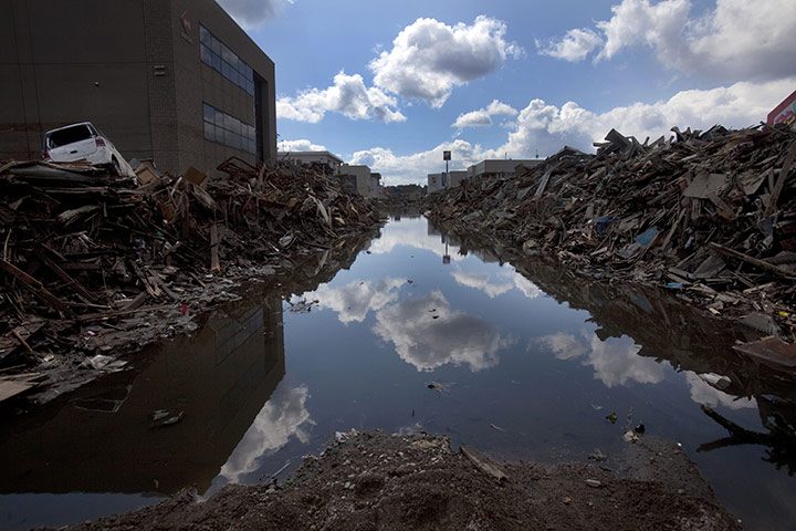 From the agencies: A flooded and debris-lined street in Kesennuma