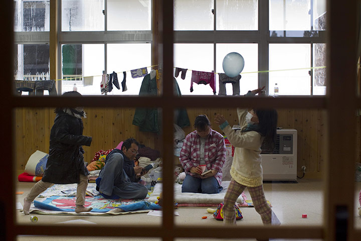 From the agencies: A family at a shelter in Rikuzentakata 