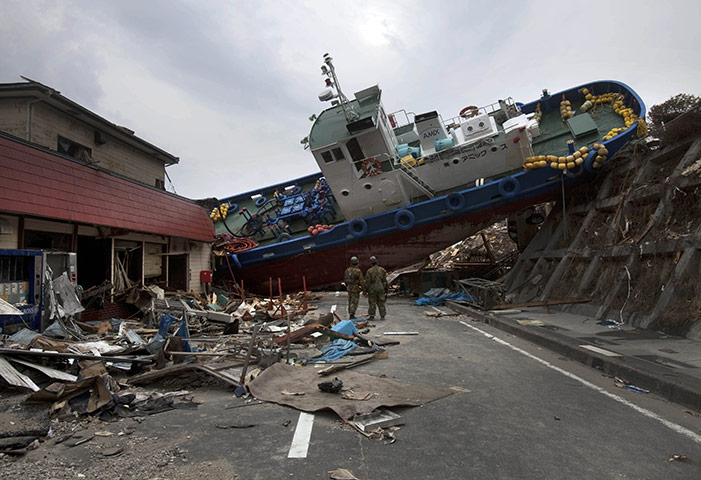From the agencies: A boat blocking a road in Onagawa