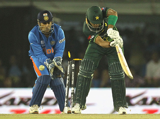 India v Pakistan: Umar Akmal is bowled by Harbhajan Singh
