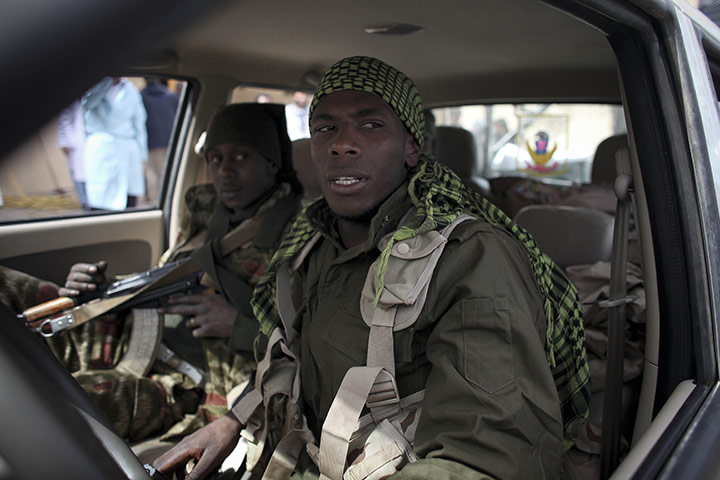 Libya unrest continues: Defected Libyan soldiers wait in their vehicle