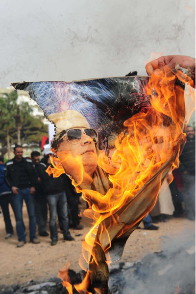 Libya unrest continues: Libyan protesters burn images of Gaddafi, Benghazi, Libya - 02 Mar 2011