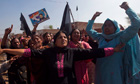 Women hold a picture of the assassinated Christian Pakistani minister Shahbaz Bhatti as they mourn