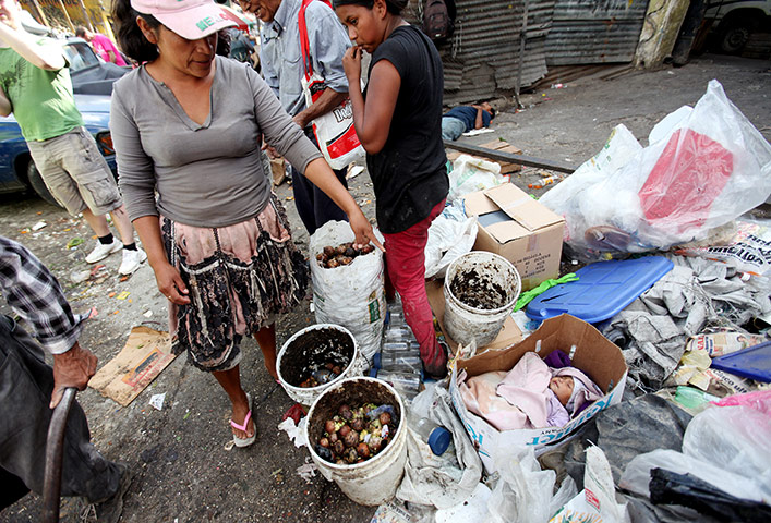 Guatemala Toybox Charity: A baby in a box in Guatemala City rubbish dump