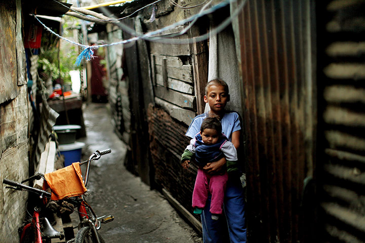 Guatemala Toybox Charity: Children stand in the doorway of their home