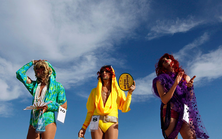 24 Hours: Sydney, Australia: Drag queens wait to compete in the the gay and lesbian mardi gras 'drag race' on Bondi beach 