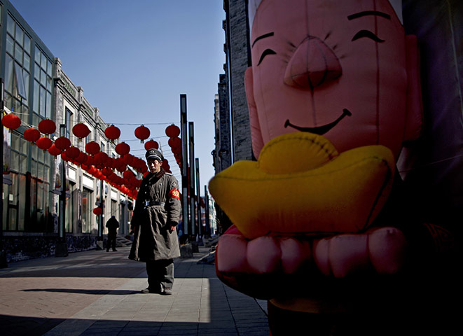 from the agencies: A security guard on the historic Qianmen street 