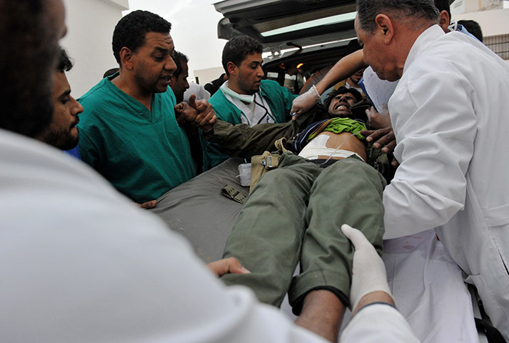 libya unrest continues: An injured Libyan rebel fighter 