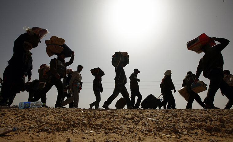 libya unrest continues: Bangladeshi evacuees walk 