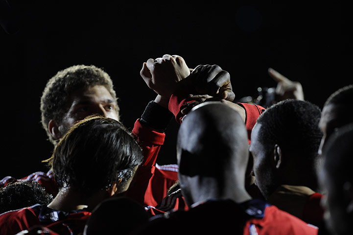 NBA: New Jersey players bump fists together in a huddle just prior to tip-off