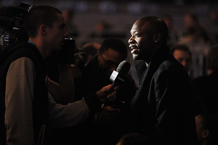 NBA: Spurs' William Gallas is interviwed by French TV during the half-time break