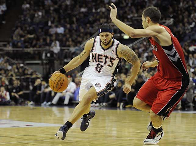 NBA: Nets' Deron Williams takes on opposing guard Jose Calderon