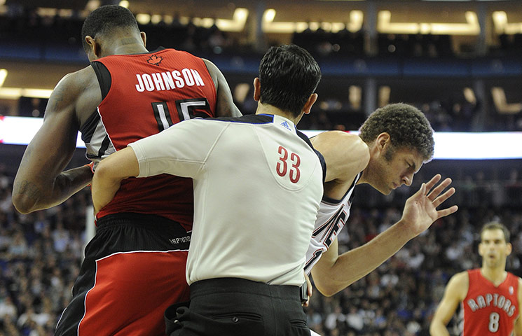 NBA: Amir Johnson & Brook Lopez are seperated by a referee in the final quarter