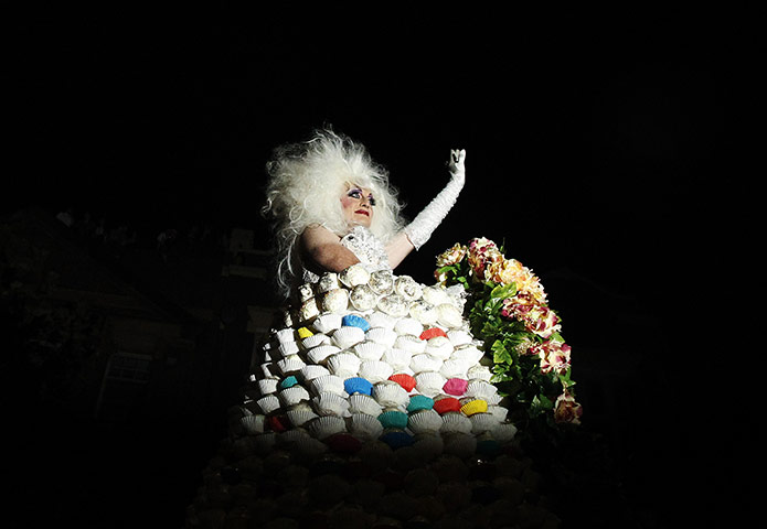 Sydney Mardi Gras: A reveller performs in a dress adorned with cup cakes