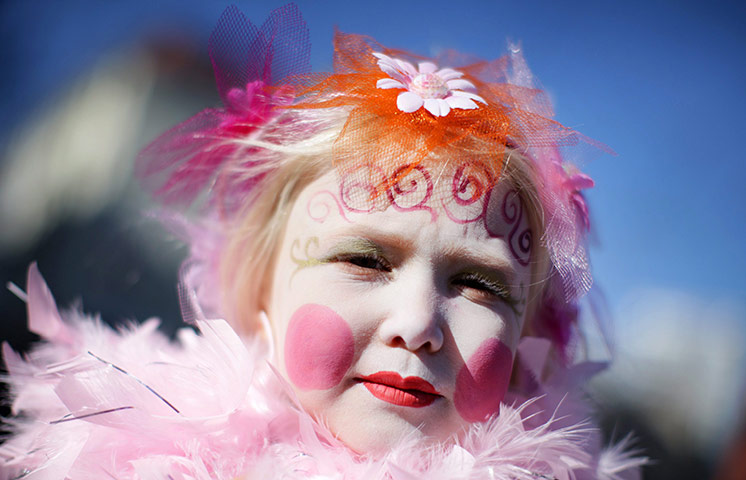 24 hours in pictures: Cologne, Germany: Young Elea takes part in a carnival 