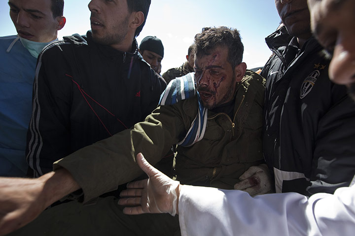 Sean Smith in Libya: A Libyan man who was injured in clashes arrives at Ras Lanuf hospital