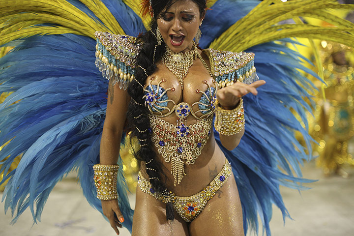 Rio carnival: Vila Isabel samba school dancer parades through the Sambadrome 