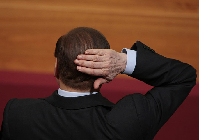 Berlusconi Surgery: Silvio Berlusconi smoothes his hair