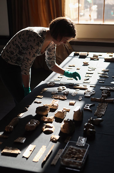 Nimrud Ivories: A technician at the British Museum holds a piece of carved ivory 