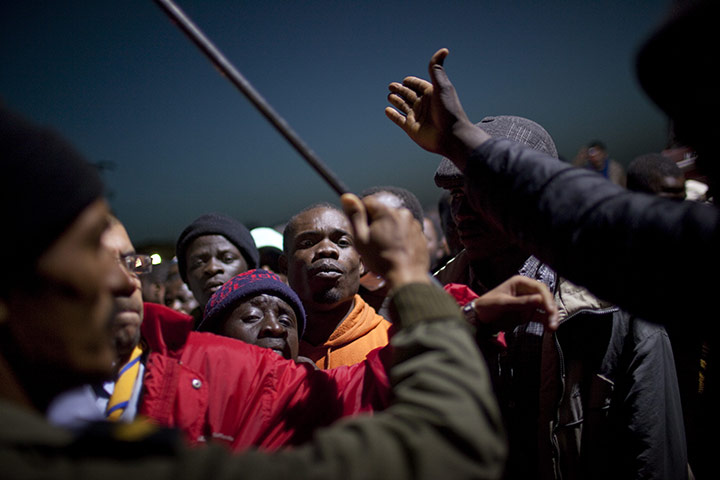 24 hours in pictures: workers from Ghana who are fleeing unrest in Libya