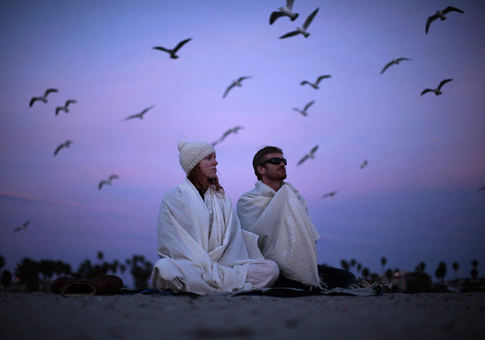 24 hours in pictures: People watch the sun set in Santa Monica