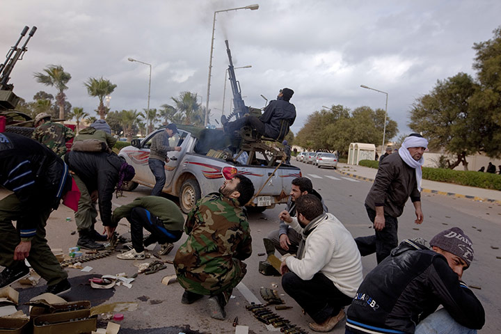Sean Smith: 8 March: Rebel fighters fire at a plane in the town centre of Ras Lanuf