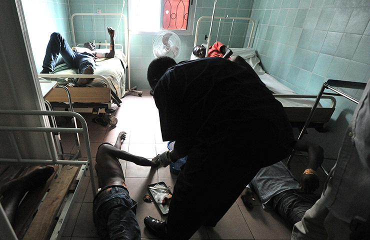 Ivory Coast violence: Injured people receive care in a hospital in Abidjan's Treichville 