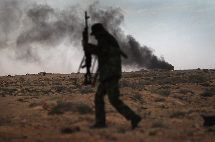 24 hours in pictures: opposition rebels battle gaddafi forces in eastern libya