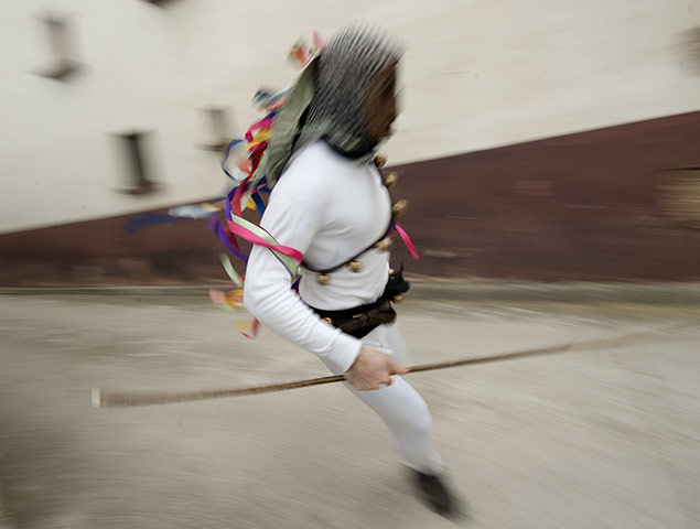 24 hours in pictures: a man dressed as a momotxorro  in spain