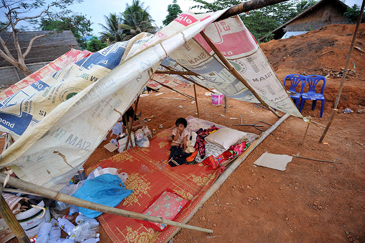 Myanmar earthquake: A Myanmar girl sits in a makeshift relie