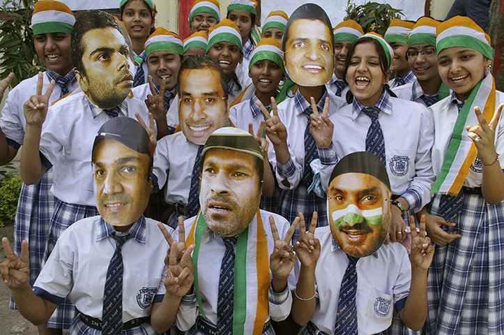 Cricket World Cup Crazy: Students wear paper masks of Indian cricketers