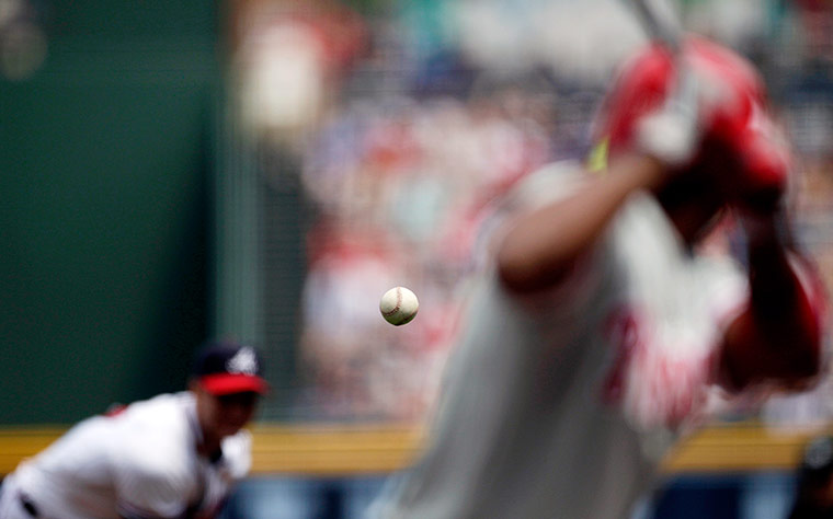 24 hours in pictures: Atlanta Braves pitcher Brandon Beachy throws ball
