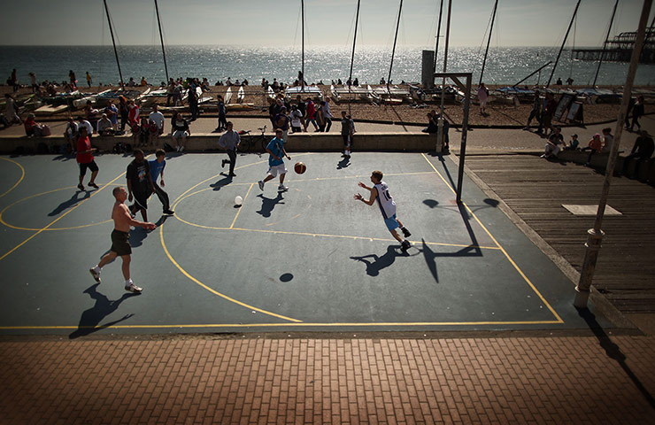 24 hours in pictures: A basketball match takes place on the sea front, Brighton, UK