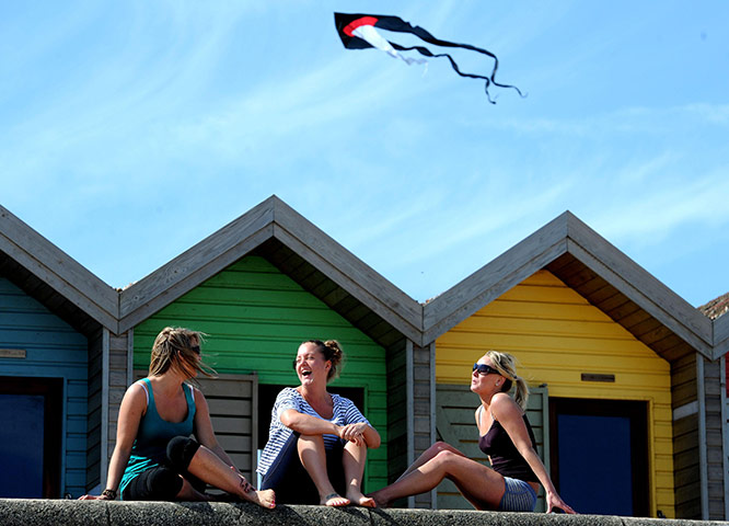 UK weather: Young women enjoy the warm weather at Blyth, Northumberland