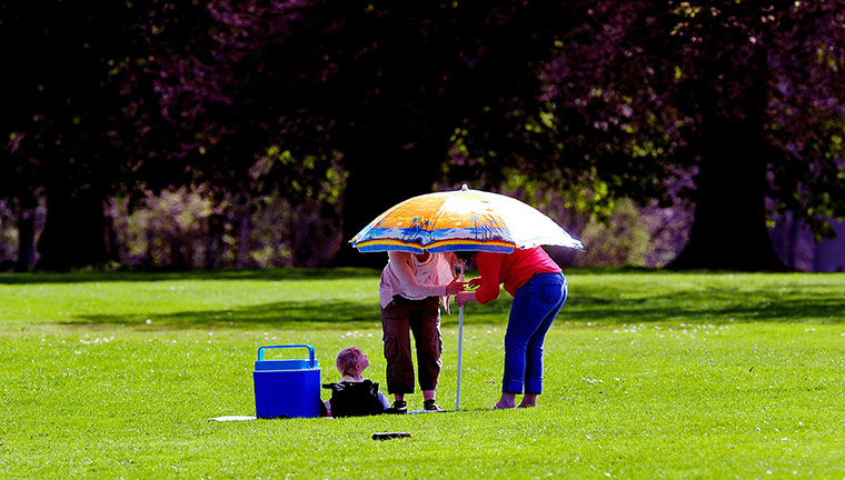 UK weather: Seeking shade Markeaton Park, Derby