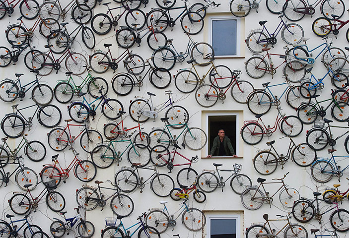 24 hours: Altlandsberg, Germany: Hundreds of bicycles hang on a bicycle rental shop 