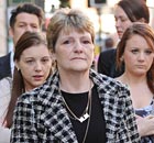 The family of Ian Tomlinson led by his wife Julia arrive at the inquest into his death 12 April 2011