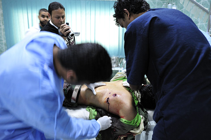 Ajdabiya, Libya : A rebel soldier being treated for gun shot wounds, Ajdabiya