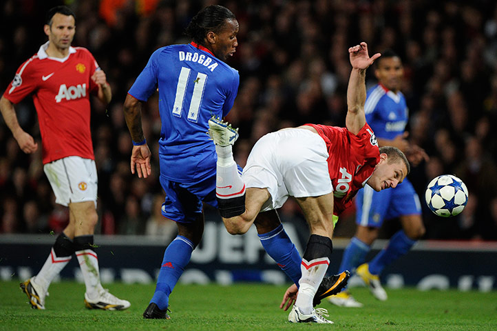 Man Utd v Chelsea: Drogba gets a nick on the ball to take it past Vidic