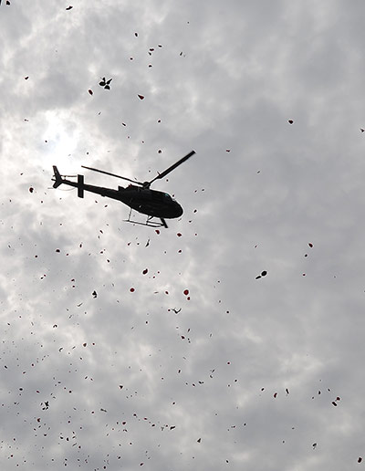 24 hours in pictures: A police helicopter throws flower petals Tasso da Silveira School in Rio